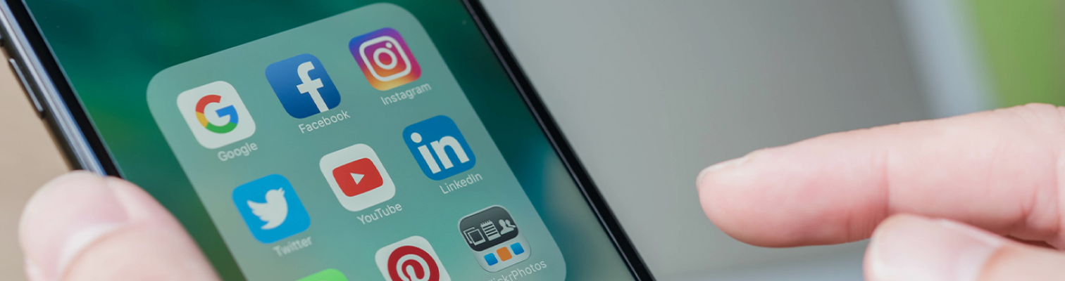 black iphone screen open to its apps, showing specifically linkedin instagram and pinterest.