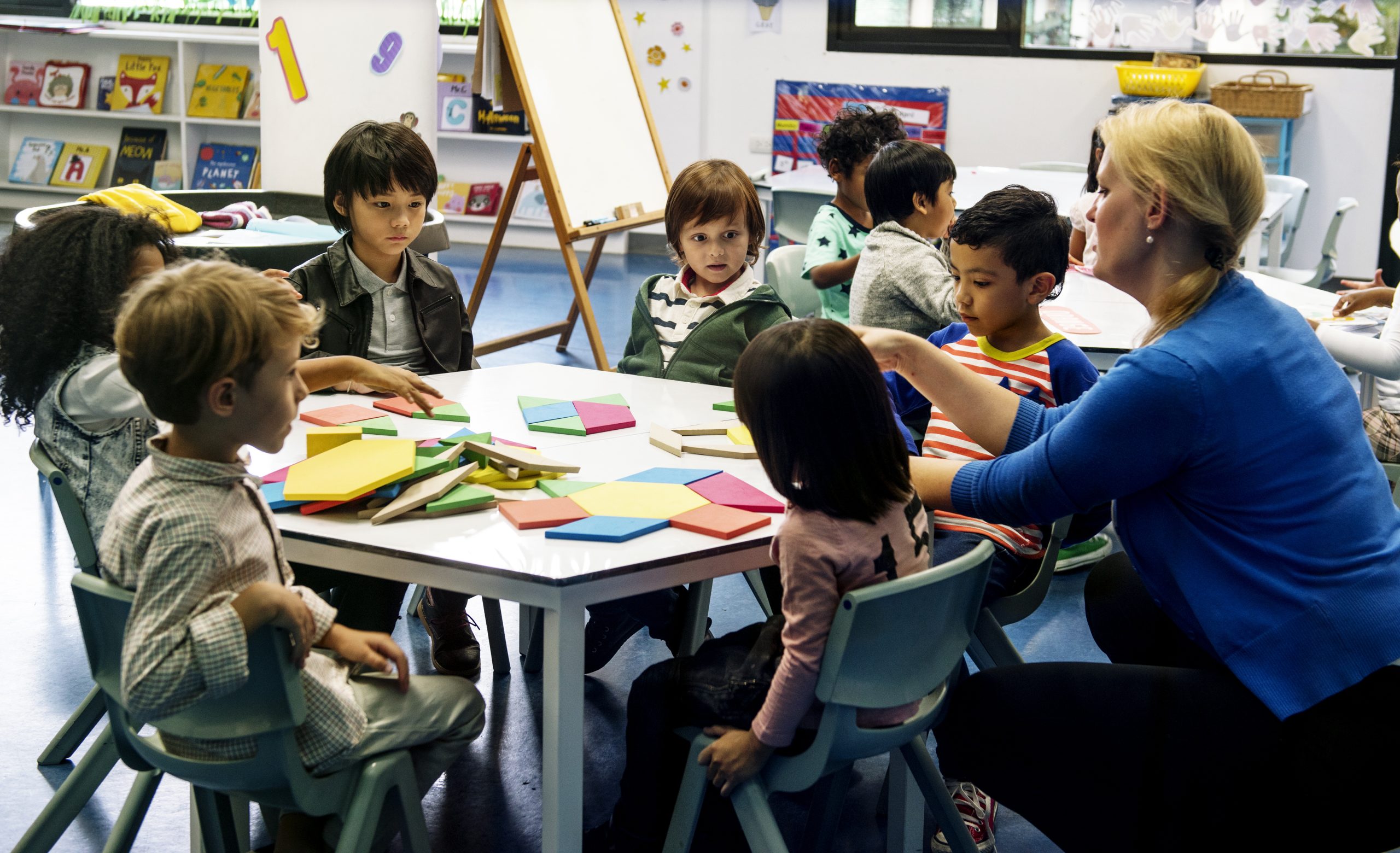 Group Of Diverse Students Sitting around a table