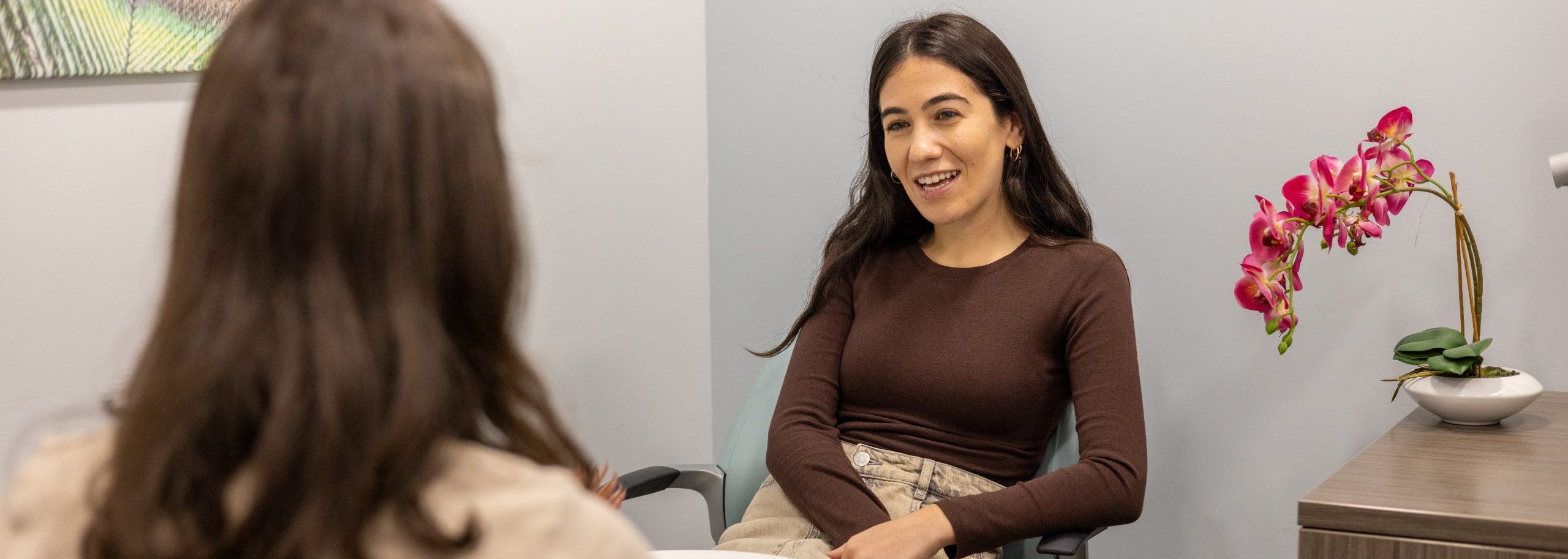Young woman recieves mental health counseling.